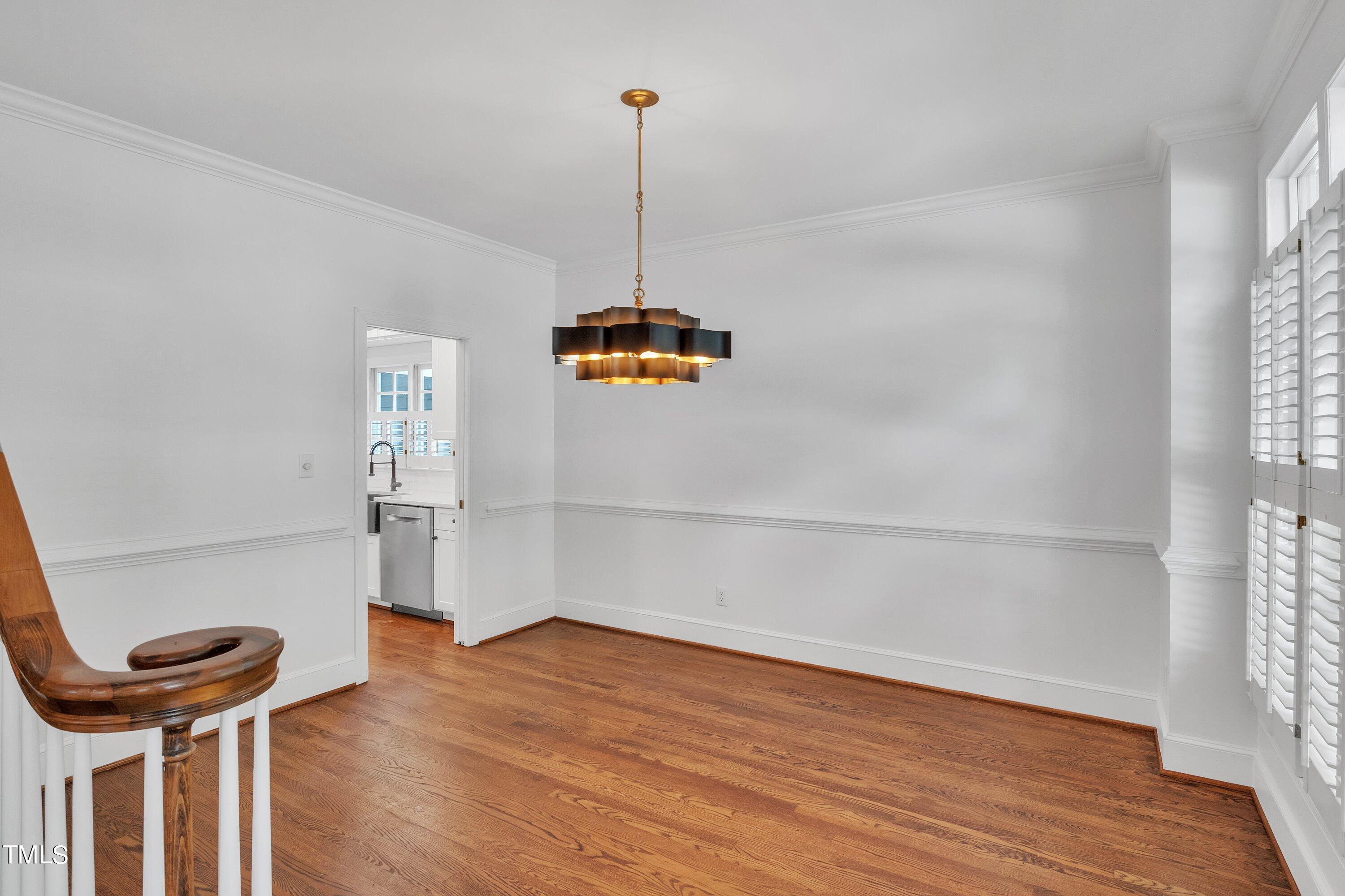 8500 Caldbeck Drive Raleigh, NC 27615 - Photo 5 of 37 a view of a room with wooden floor and a window