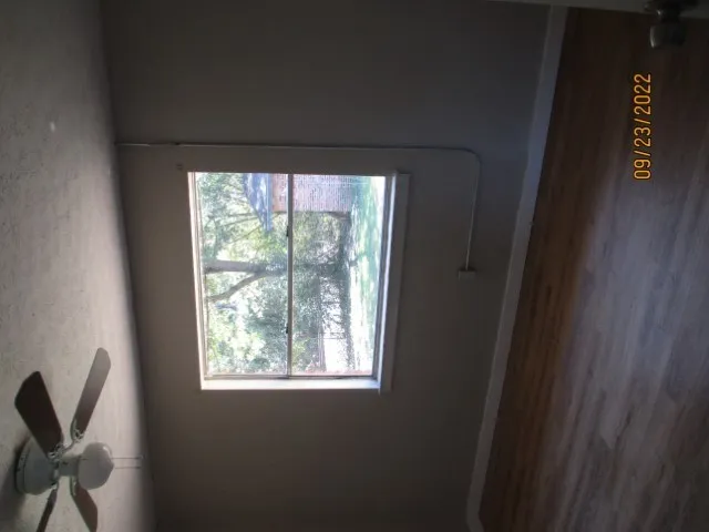 a room with a window and a chair