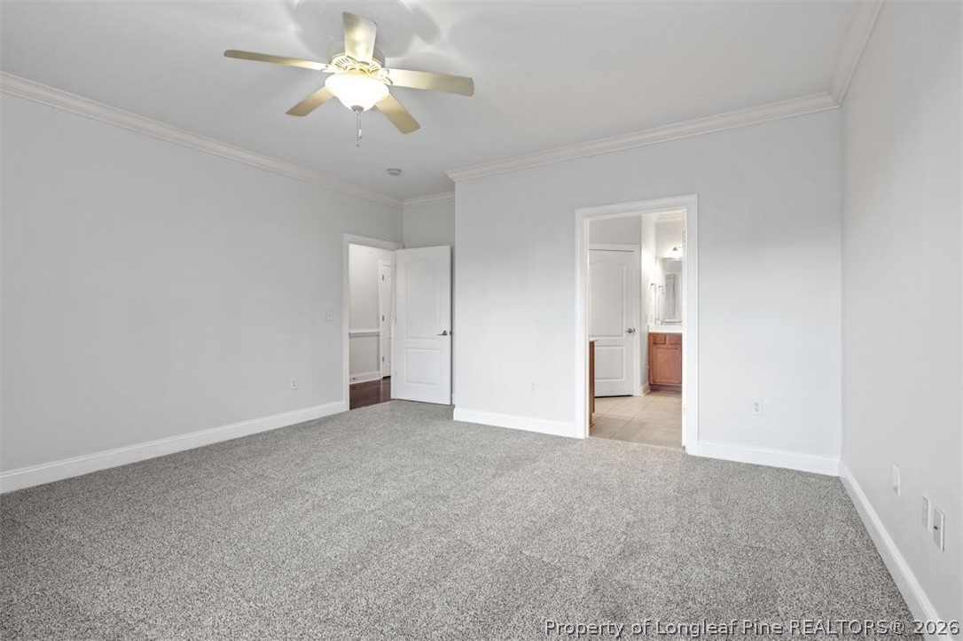 62 Gallery Drive, Unit 102 Spring Lake, NC 28390 - Photo 11 of 23 a view of an empty room with a ceiling fan