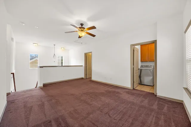 a view of a kitchen with a sink and a cabinet