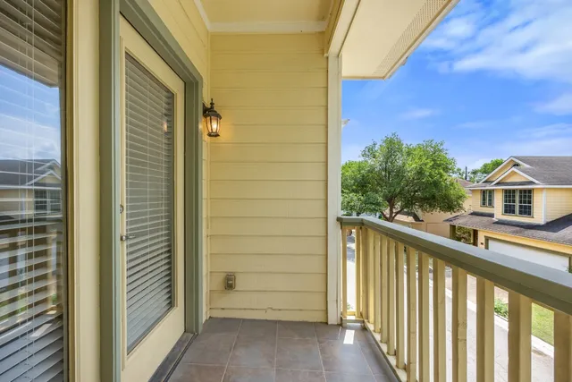 a large bathroom with a double vanity sink a mirror and a bathtub
