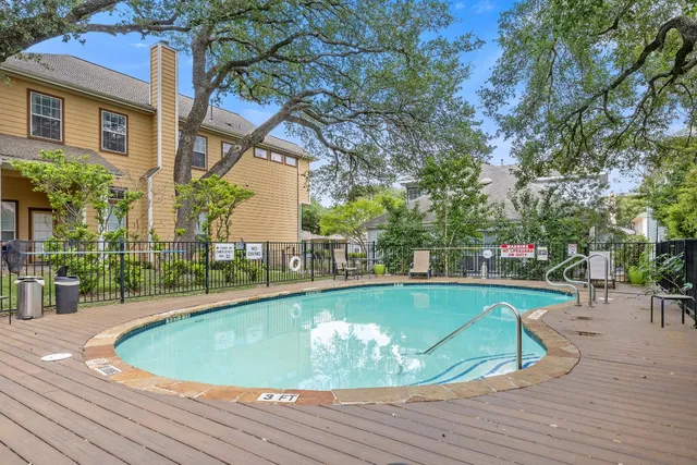 a view of a swimming pool with a patio