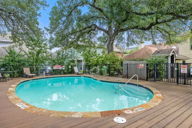 a view of a house with a tree and garage