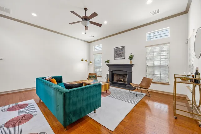 a living room with furniture and a fireplace