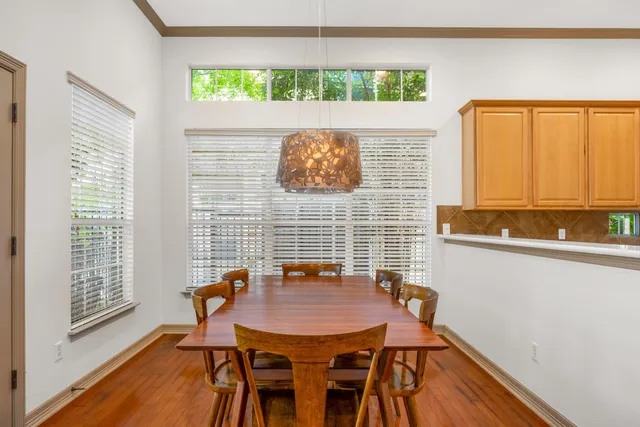 a view of a dining room with furniture and a window
