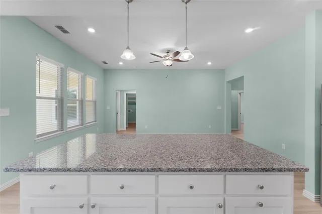 a view of a granite countertop cabinets a sink and dishwasher