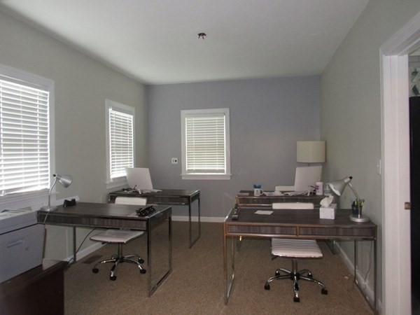 351 Plantation Street Worcester, MA 01604 - Photo 4 of 4 a view of a workspace with a window and lounge chair