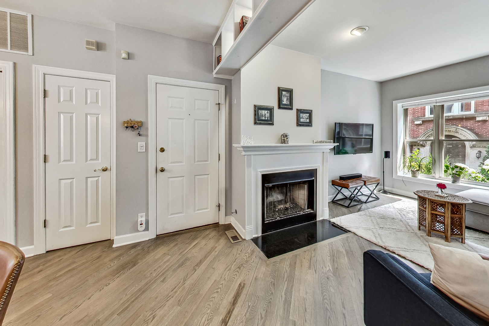 4638 North Racine Avenue, Unit 1 Chicago, IL 60640 - Photo 5 of 26 a living room with furniture and a fireplace