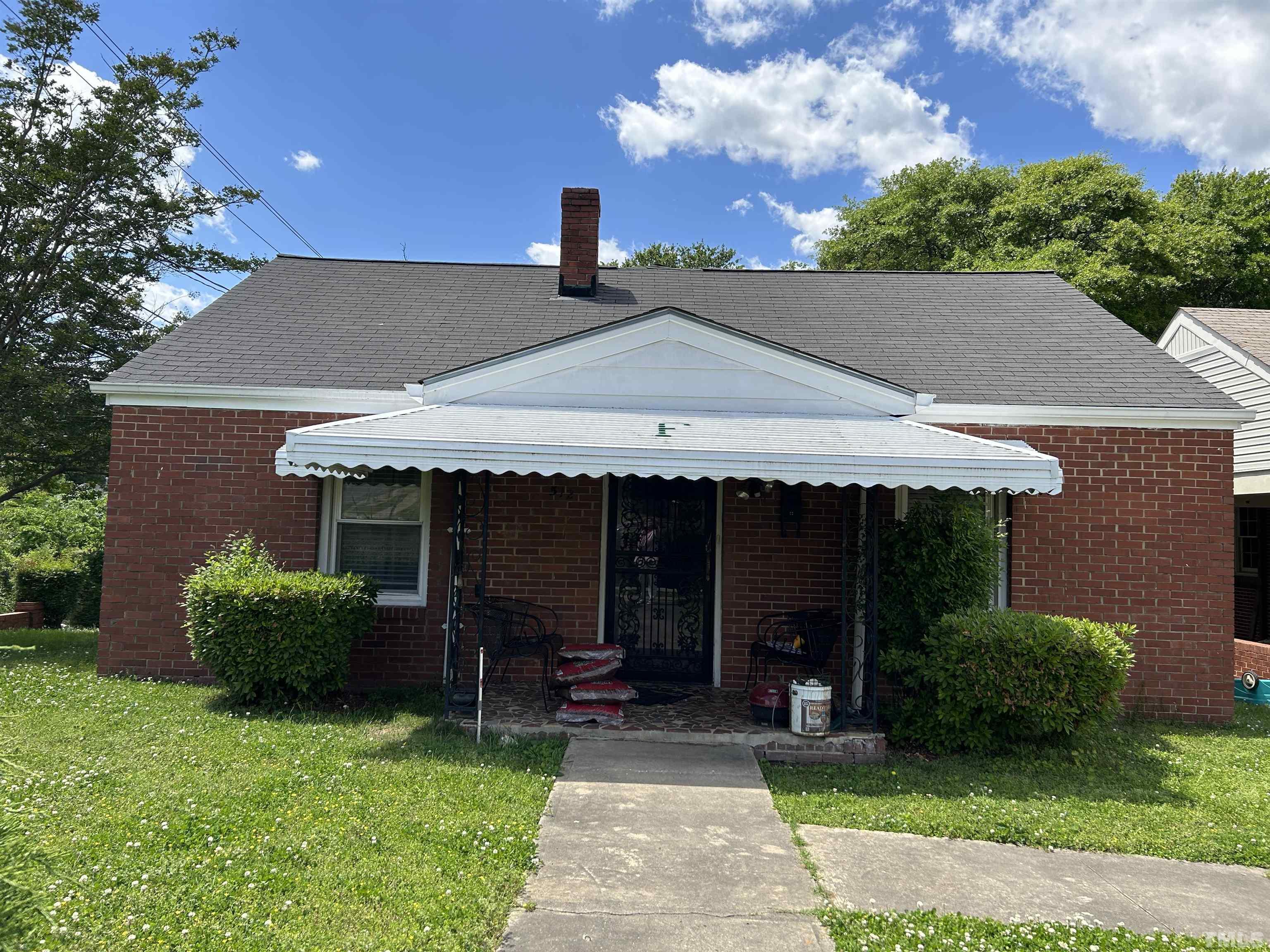 512 Coleman Street Raleigh, NC 27601 - Photo 2 of 3 a front view of a house with garden