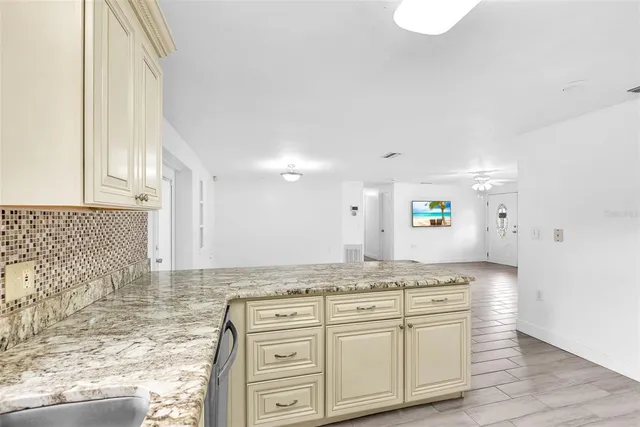 a view of a granite countertop cabinets