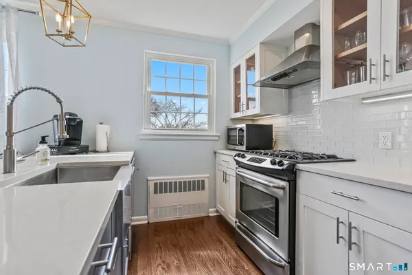 a kitchen with a stove and a sink