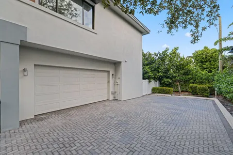 a view of backyard with a garage