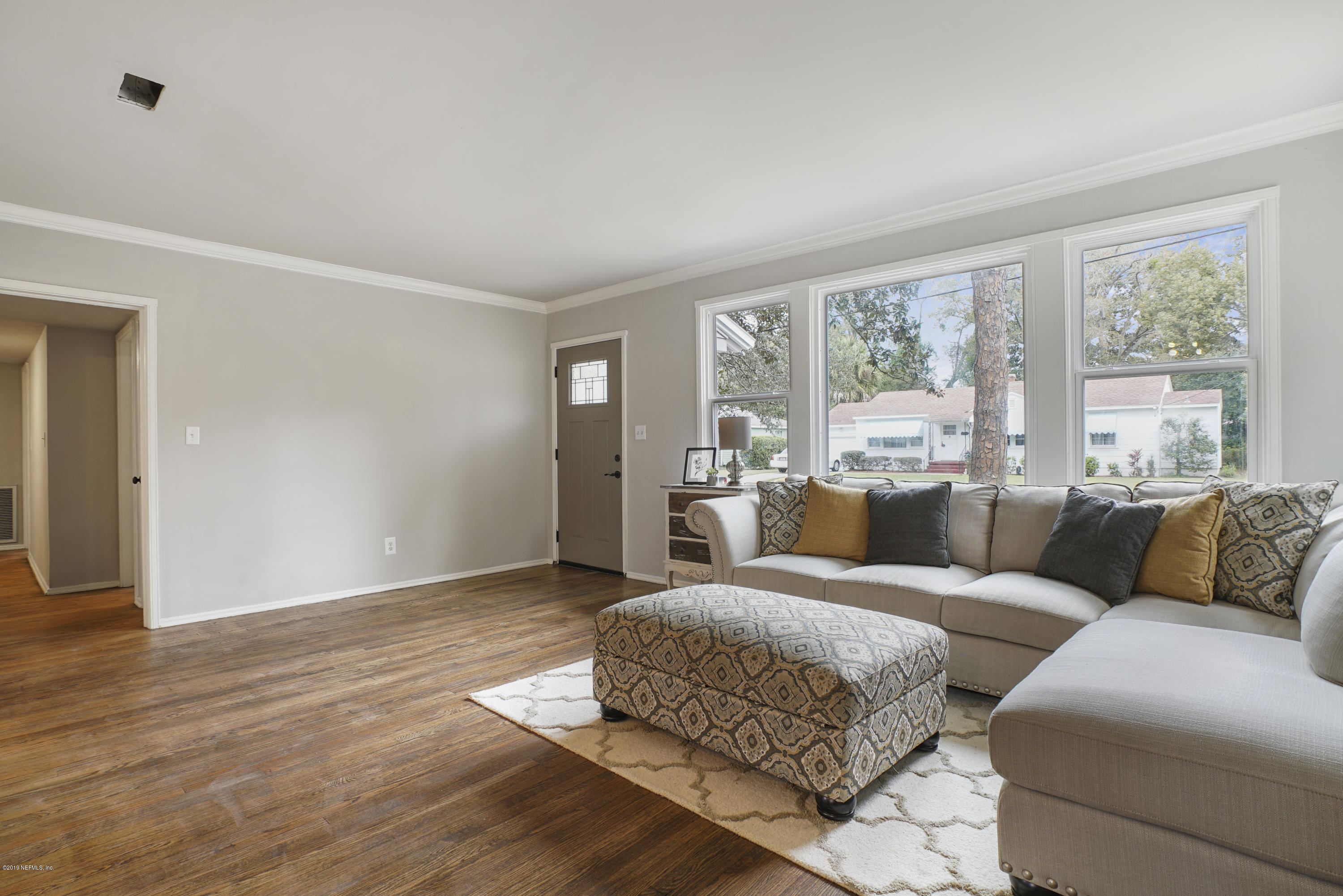 1814 Mayfair Road Jacksonville, FL 32207 - Photo 3 of 18 a living room with furniture and large windows