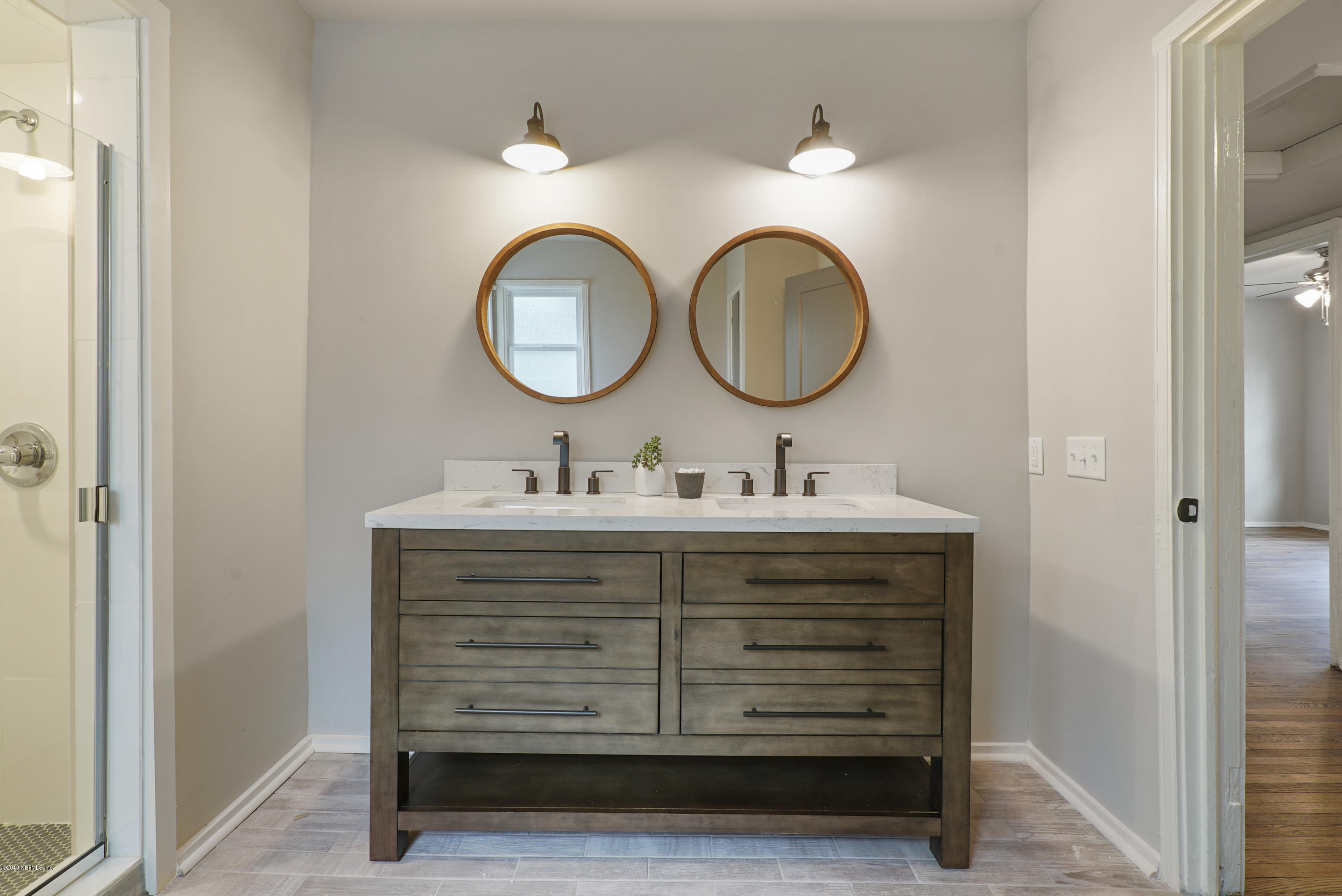 1814 Mayfair Road Jacksonville, FL 32207 - Photo 9 of 18 a bathroom with a sink and a mirror