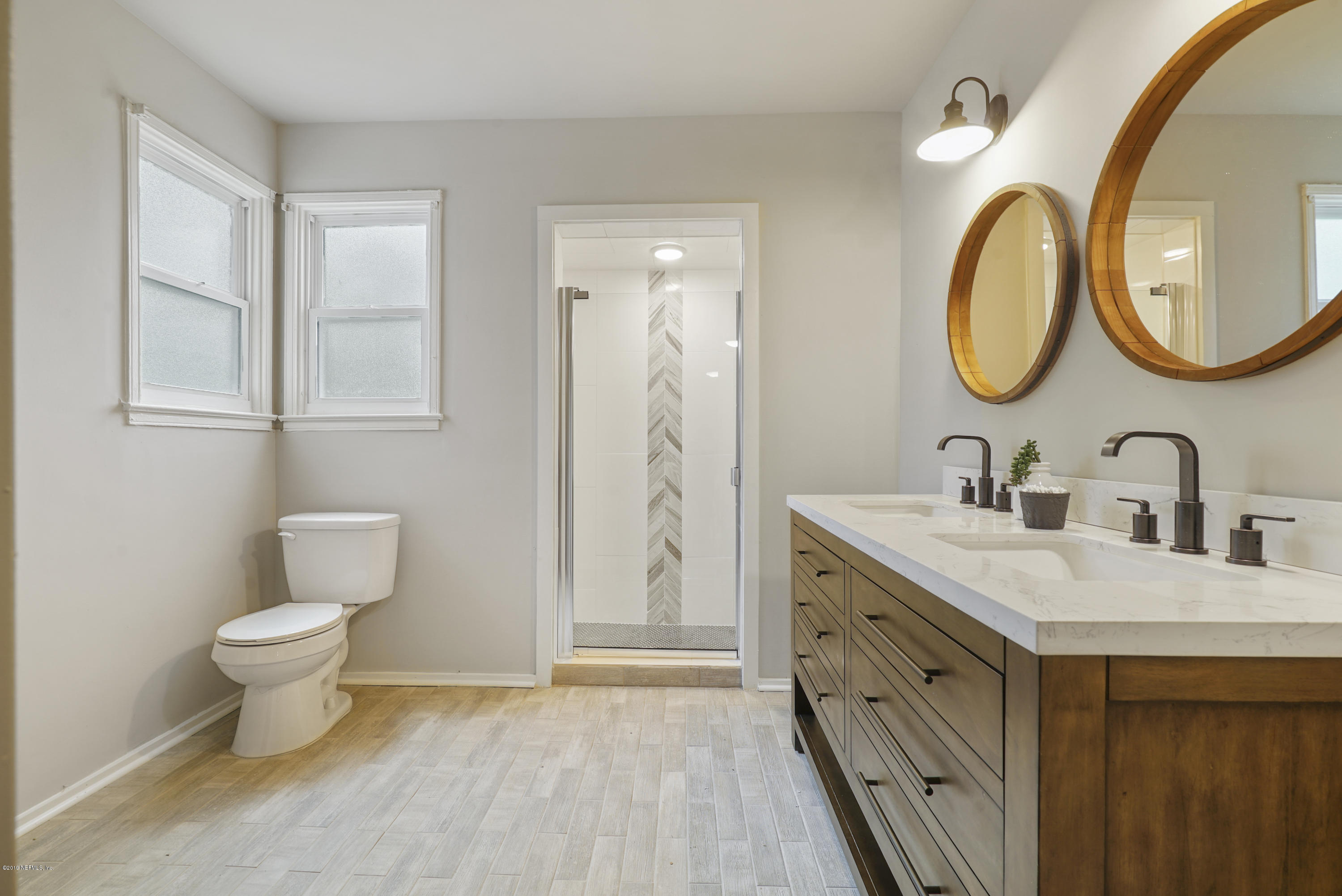 1814 Mayfair Road Jacksonville, FL 32207 - Photo 10 of 18 a bathroom with a toilet sink and mirror