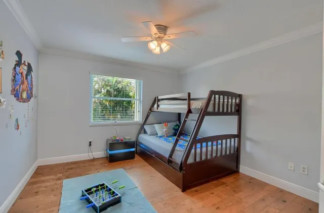 a bedroom with furniture and a window
