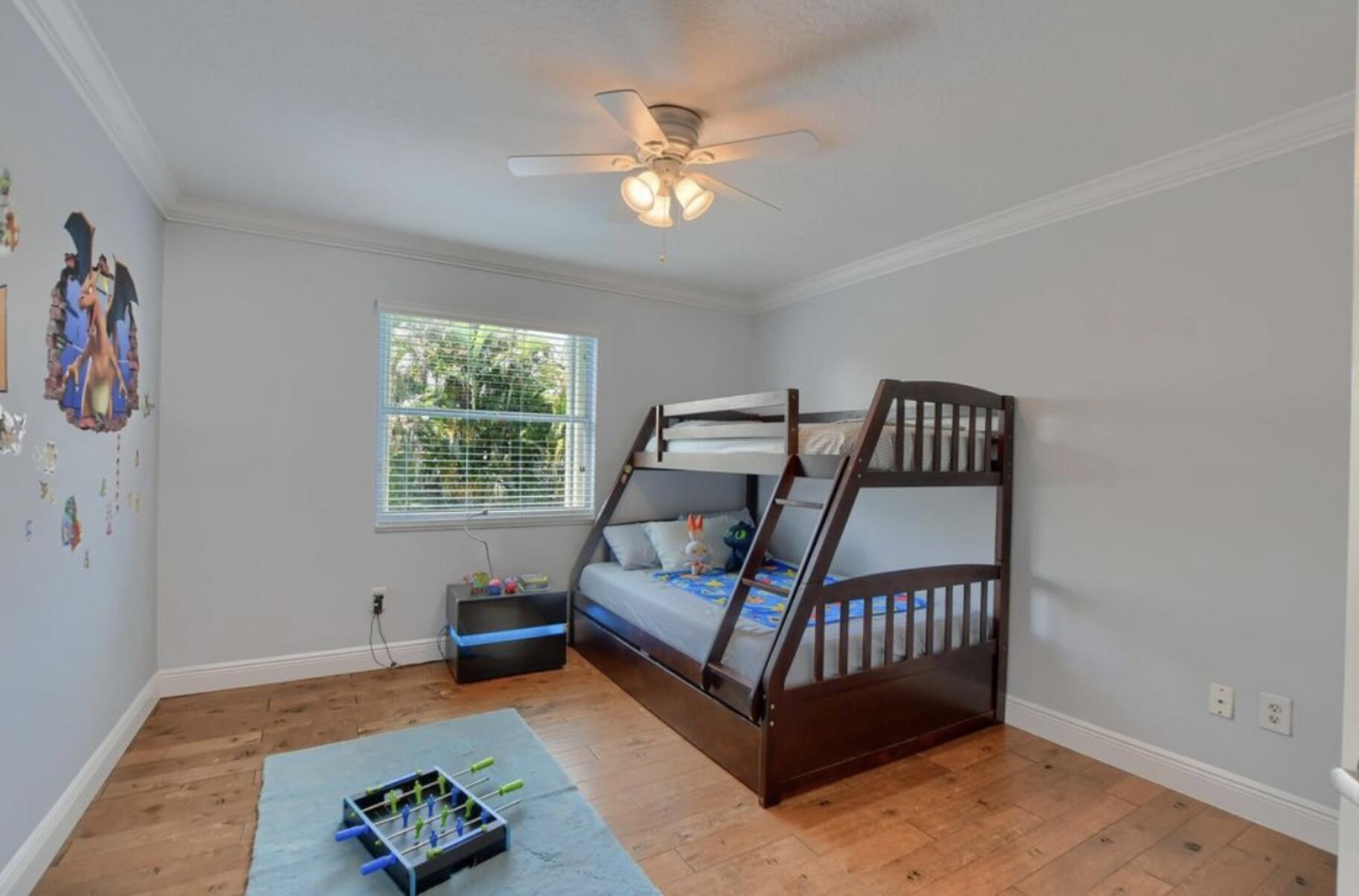 9460 Lake Serena Drive Boca Raton, FL 33496 - Photo 16 of 21 a bedroom with furniture and a window