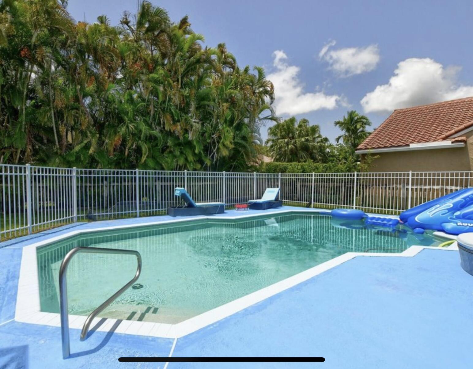 9460 Lake Serena Drive Boca Raton, FL 33496 - Photo 4 of 21 a view of a garden with swimming pool