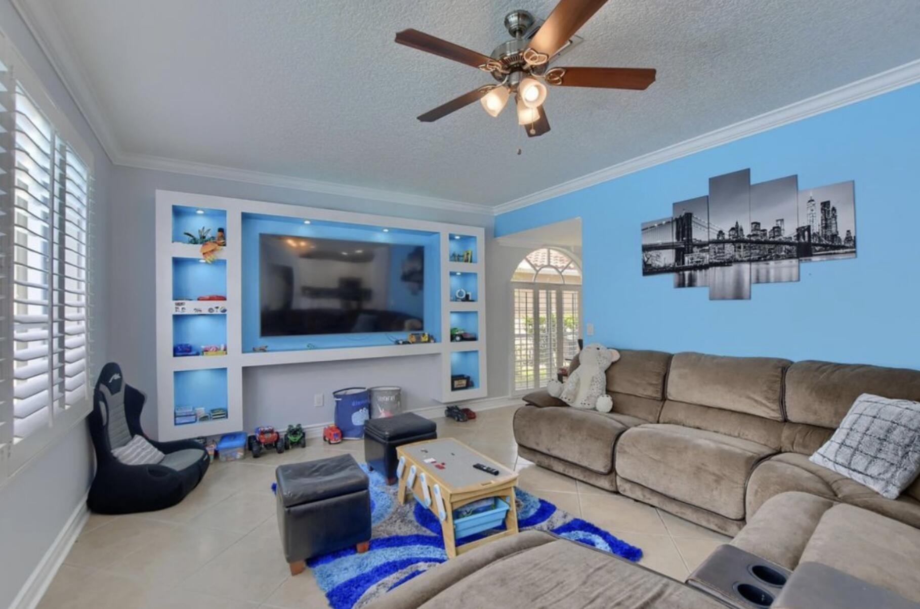 9460 Lake Serena Drive Boca Raton, FL 33496 - Photo 7 of 21 a living room with furniture and a flat screen tv