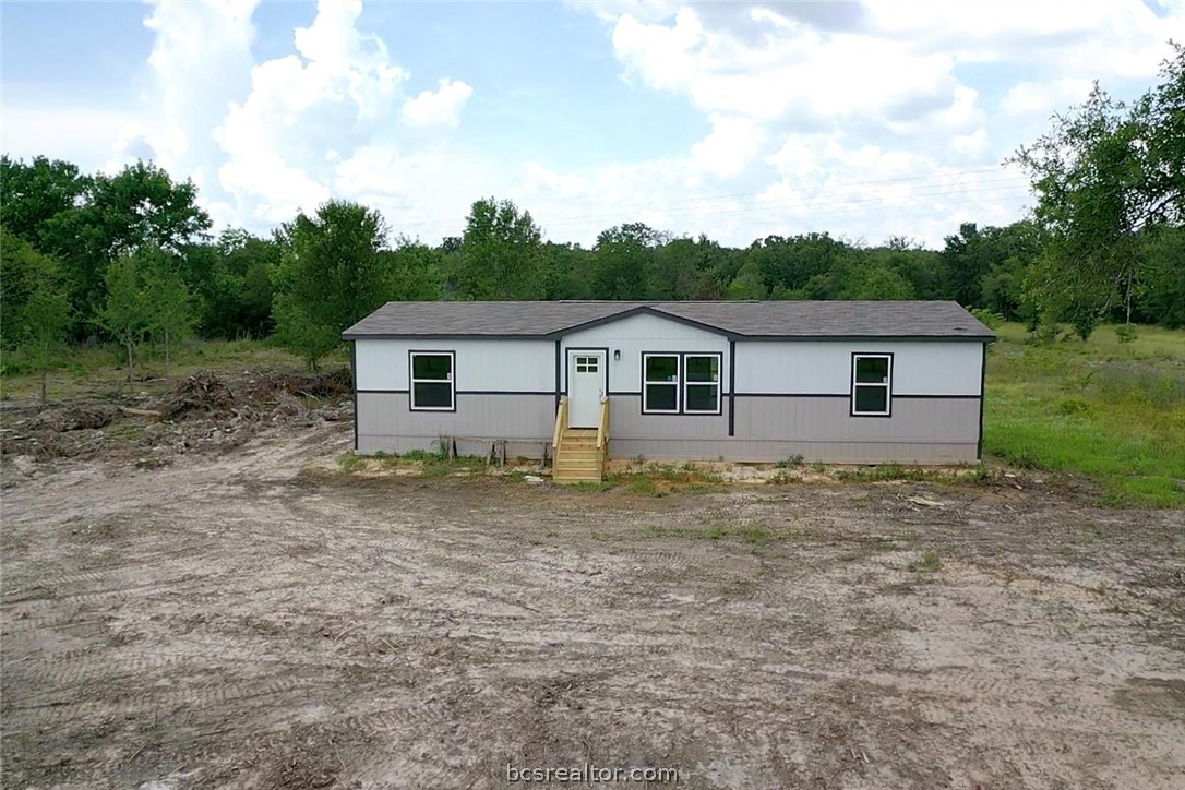 9960 Goose Prairie Road Midway, TX 75852 - Photo 2 of 36 a view of a house with a backyard