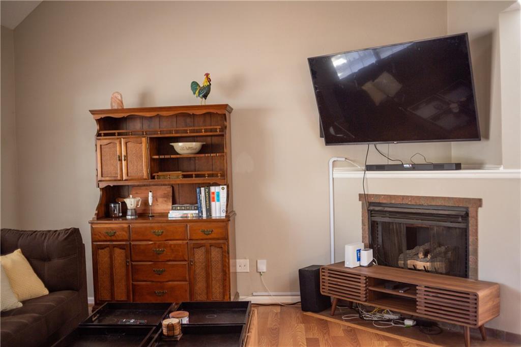 280 Mimosa Road Phenix City, AL 36870 - Photo 9 of 38 Living room with light wood-type flooring and a fireplace