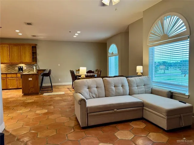 a living room with furniture and a window