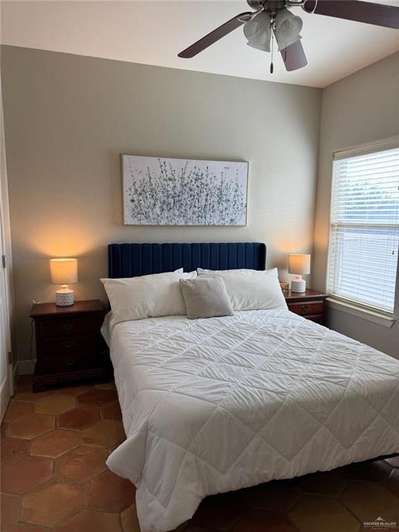 1412 Keeton Avenue, Unit 28 McAllen, TX 78503 - Photo 10 of 15 a large bed sitting in a bedroom next to a window