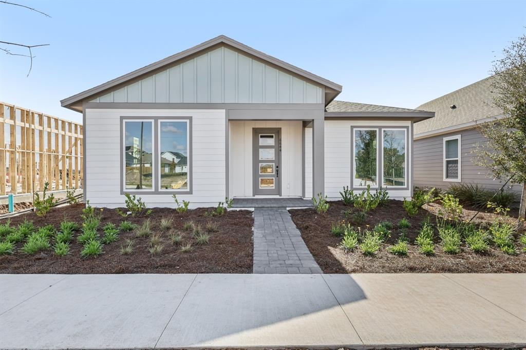 6644 Wake Street St. Cloud, FL 34771 - Photo 1 of 48 a front view of a house with garden