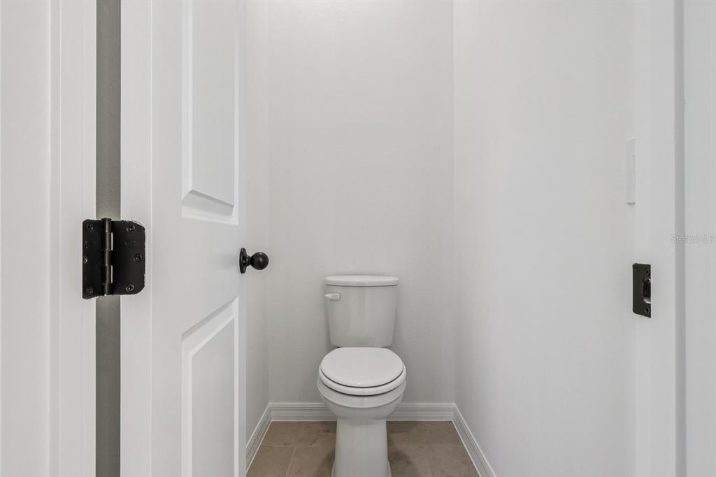 6644 Wake Street St. Cloud, FL 34771 - Photo 31 of 48 a bathroom with a toilet and a shower