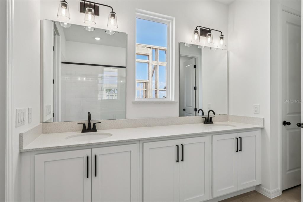 6644 Wake Street St. Cloud, FL 34771 - Photo 34 of 48 a bathroom with a sink and mirror