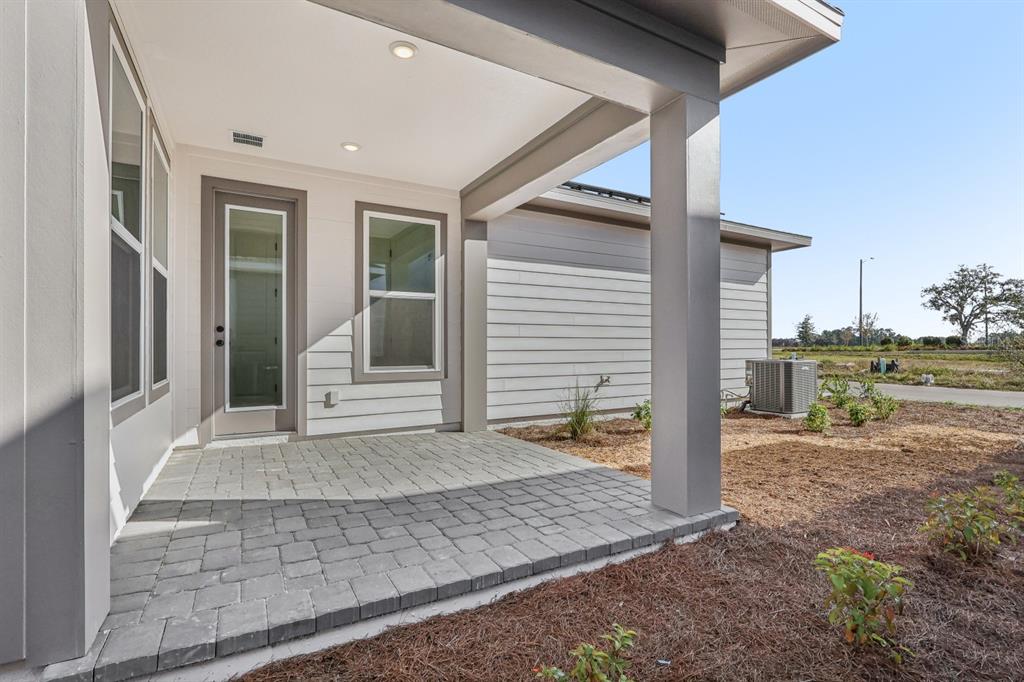 6644 Wake Street St. Cloud, FL 34771 - Photo 37 of 48 a view of a house with a backyard