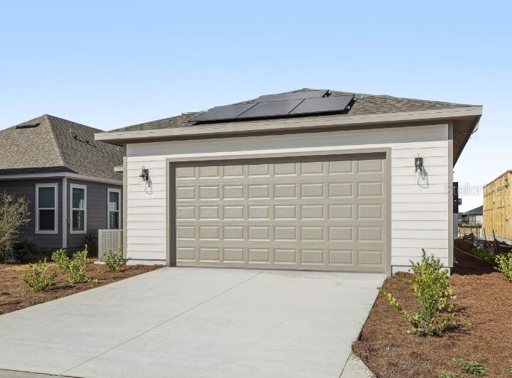 6644 Wake Street St. Cloud, FL 34771 - Photo 40 of 48 a front view of a house with a yard and garage