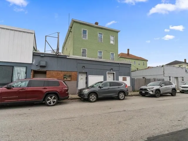 a view of a cars parked in front of a house