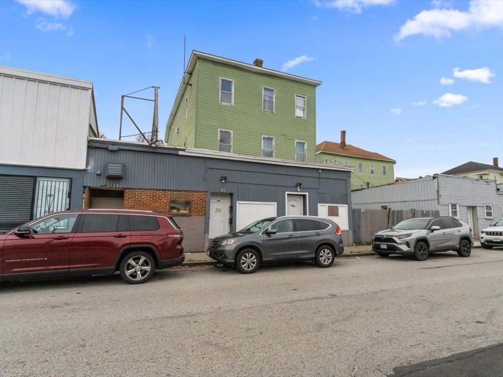 a view of a cars parked in front of a house