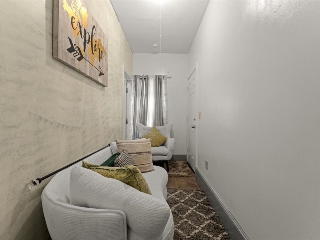 120 Grand Street Worcester, MA 01603 - Photo 14 of 36 a living room with furniture and a rug