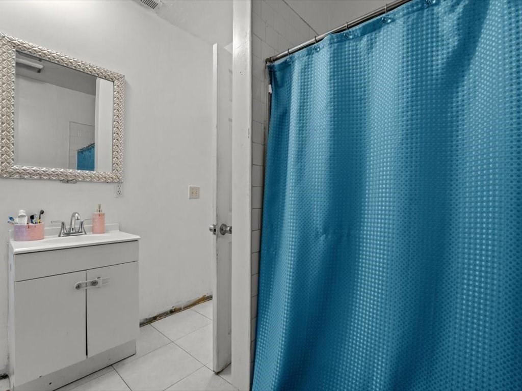 120 Grand Street Worcester, MA 01603 - Photo 20 of 36 a bathroom with a sink and mirror