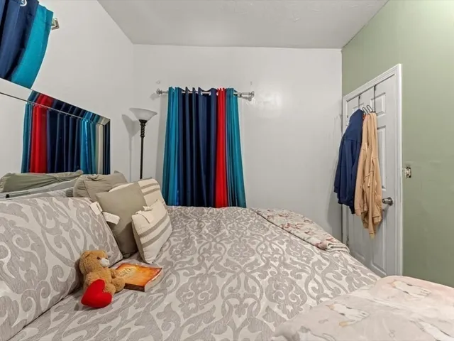a bedroom with a bed and a large closet