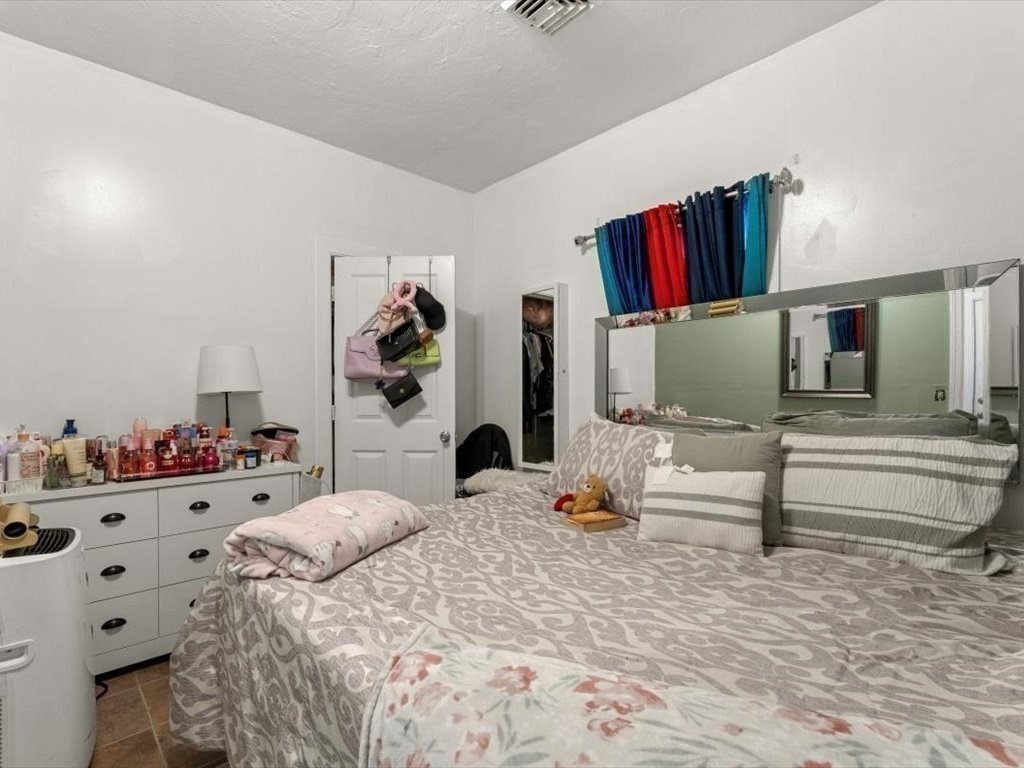 120 Grand Street Worcester, MA 01603 - Photo 22 of 36 a bedroom with a bed and dresser