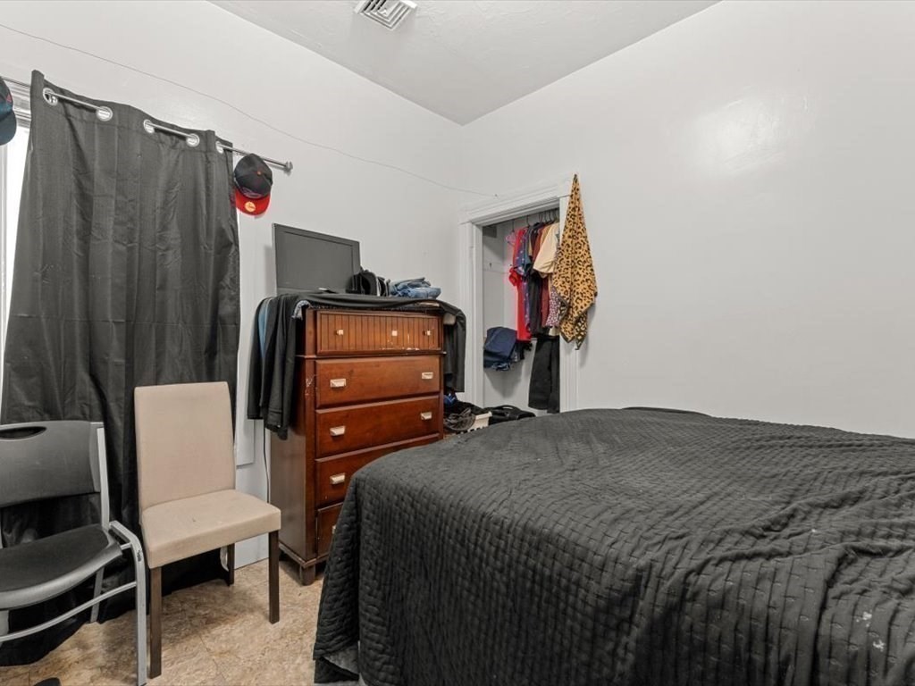 120 Grand Street Worcester, MA 01603 - Photo 25 of 36 a bedroom with a bed and a closet