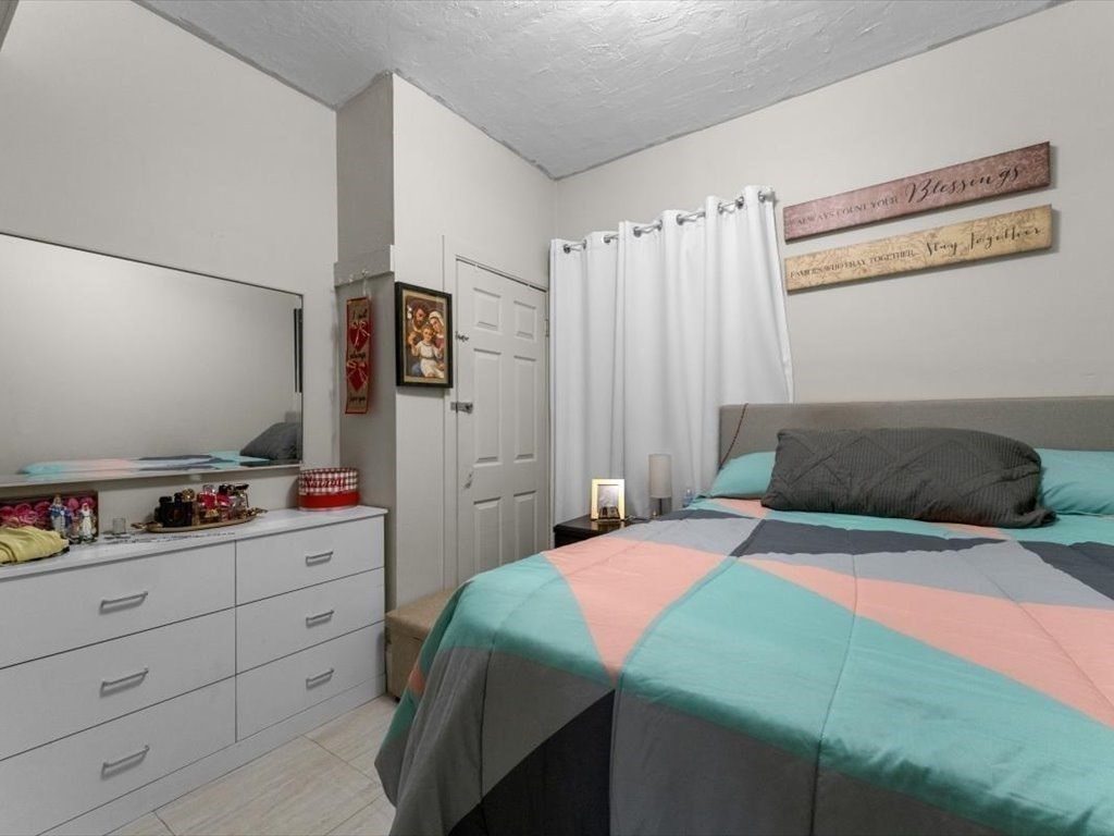 120 Grand Street Worcester, MA 01603 - Photo 10 of 36 a bedroom with a bed and a closet