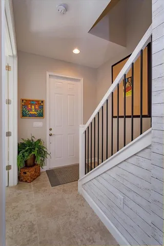 a view of hallway with wooden floor and plants