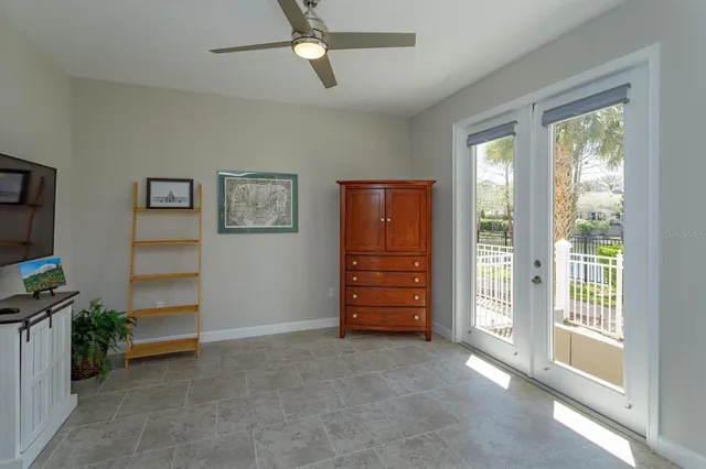 a view of room with furniture and a ceiling fan