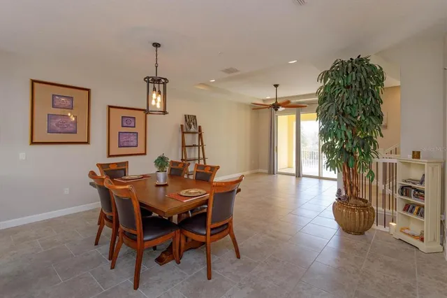 a view of a dining room with furniture and chandelier