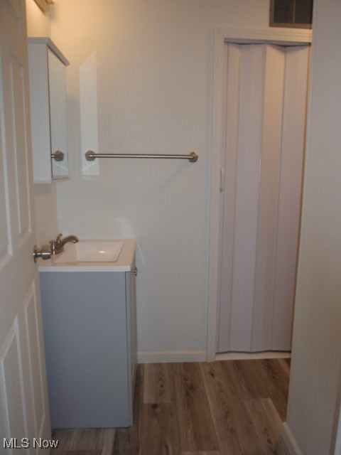 14203 Darrow Road Vermilion, OH 44089 - Photo 11 of 26 Bathroom featuring wood finished floors and vanity