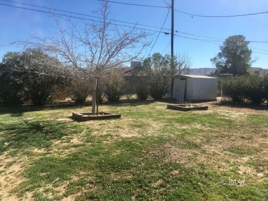 1028 Mayo Street Ridgecrest, CA 93555 - Photo 11 of 25 a view of outdoor space with deck and yard
