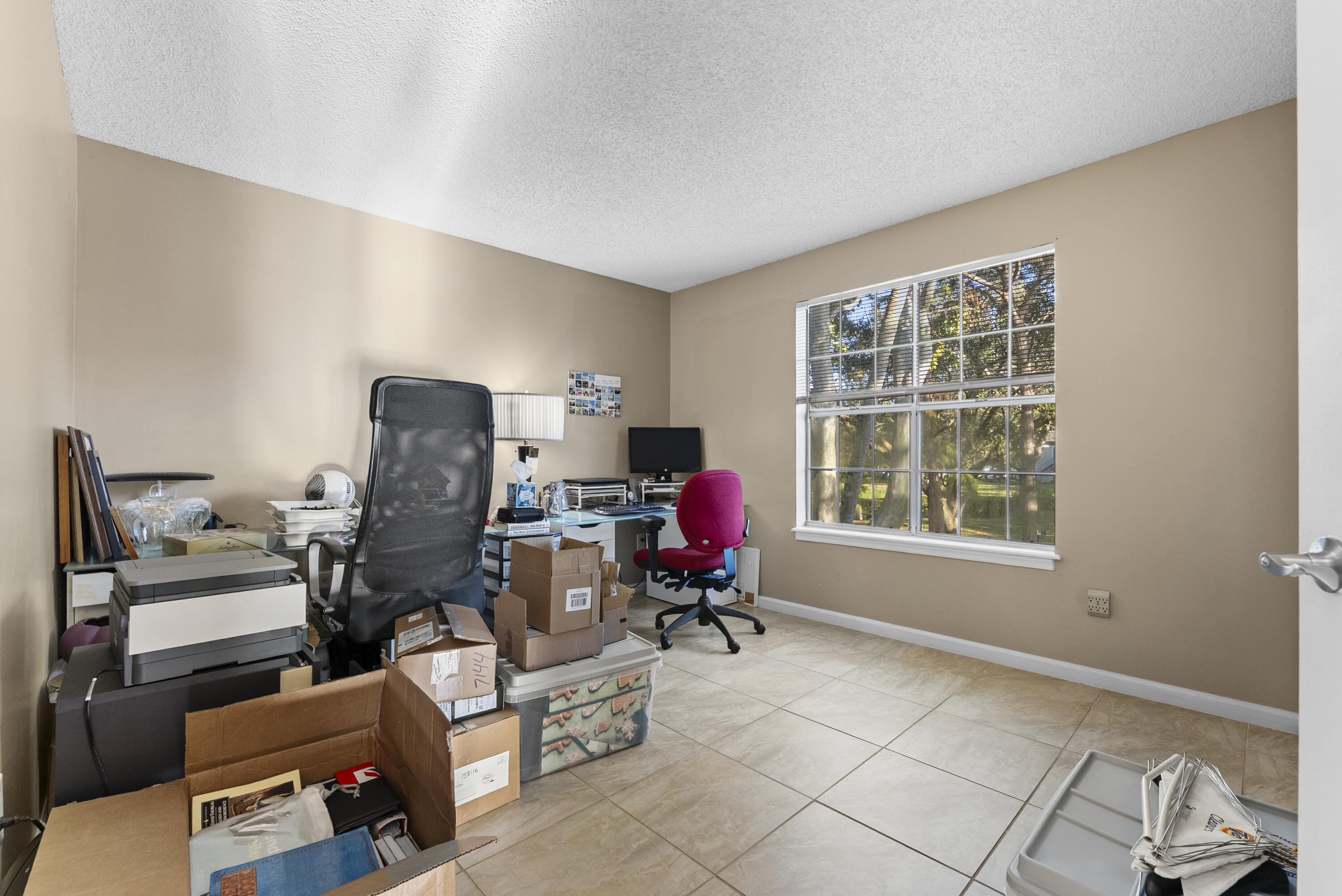 1365 Crystal Way, Unit H Delray Beach, FL 33444 - Photo 15 of 34 a living room with furniture and a window