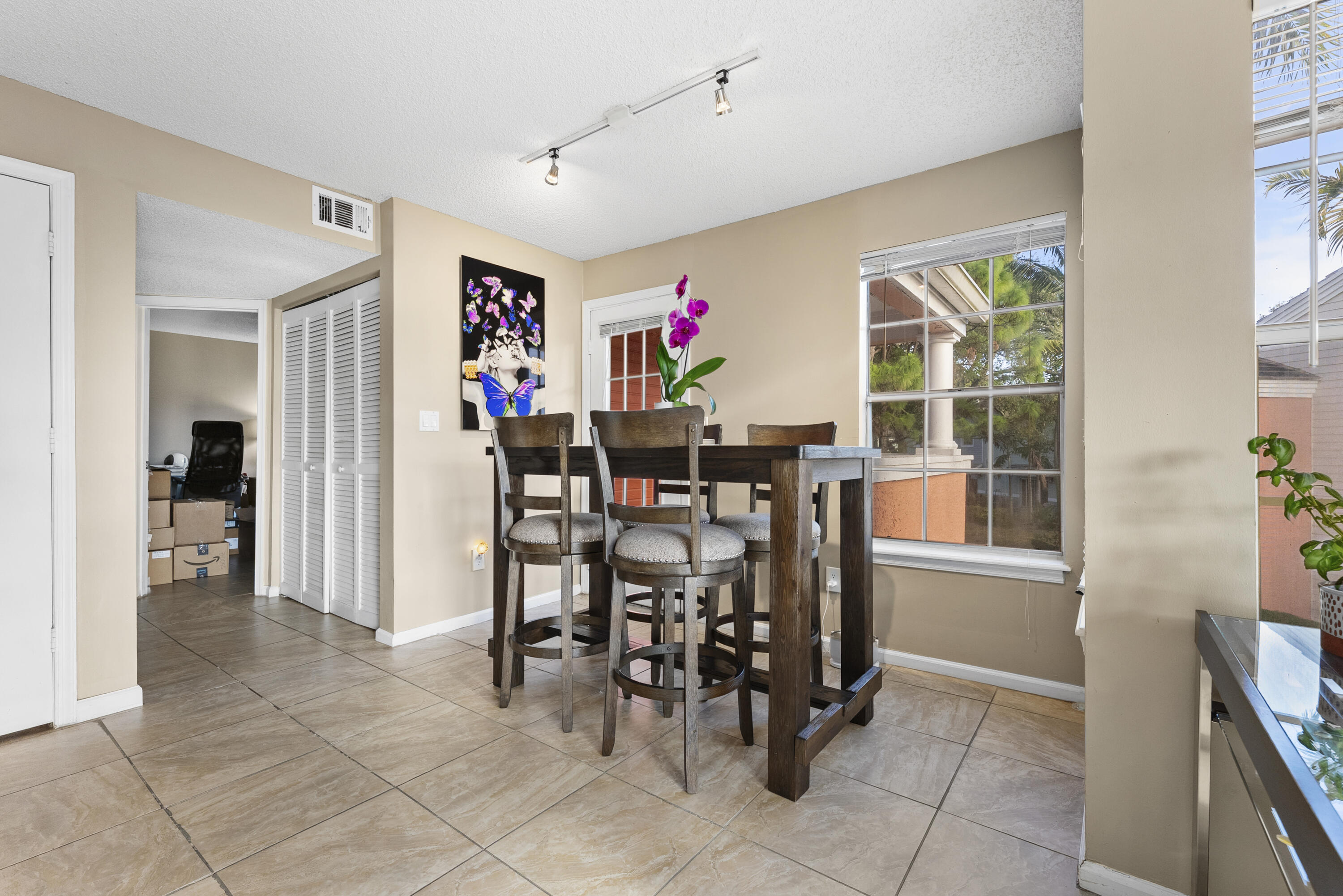 1365 Crystal Way, Unit H Delray Beach, FL 33444 - Photo 16 of 34 a view of a dining room with furniture and a window