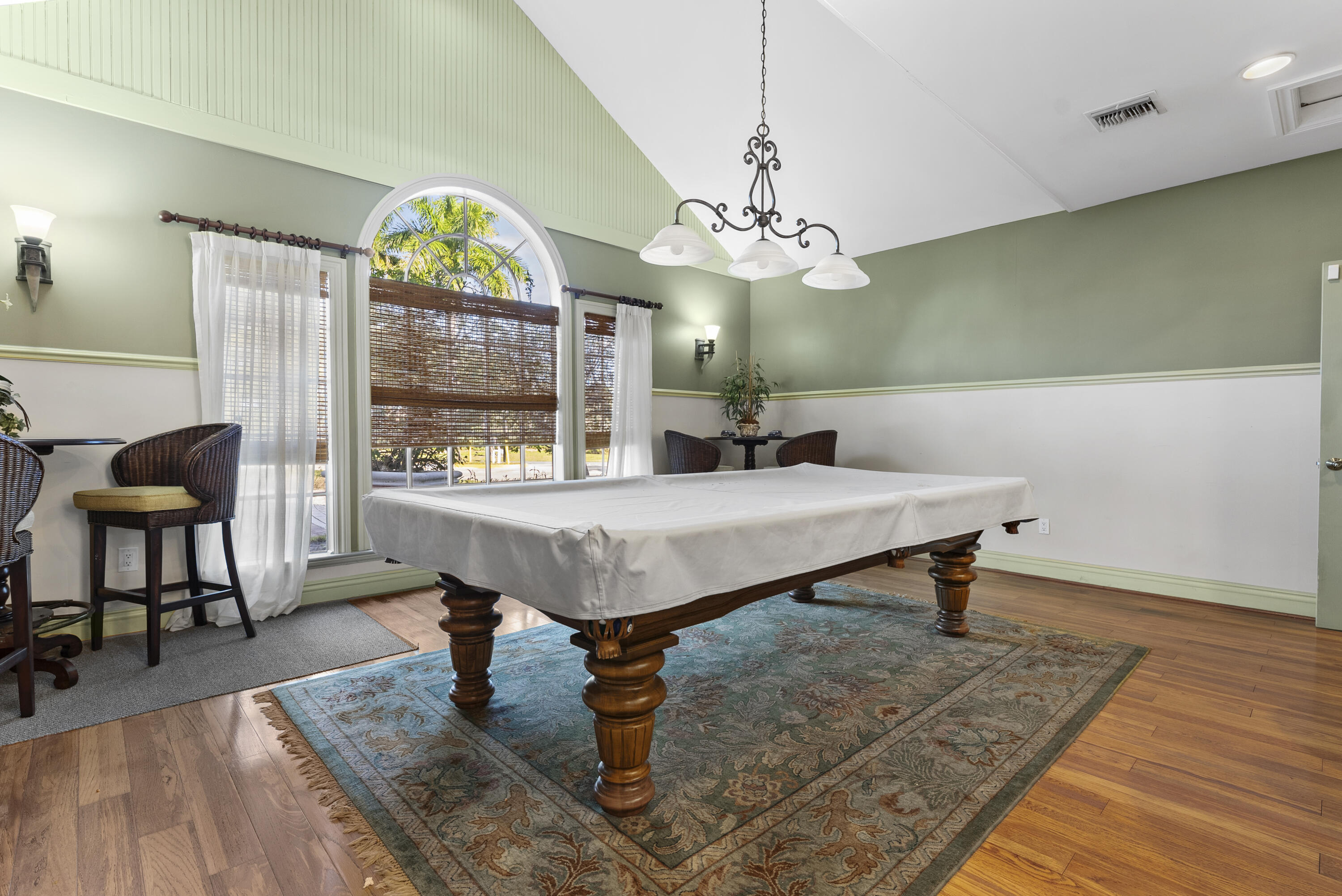 1365 Crystal Way, Unit H Delray Beach, FL 33444 - Photo 18 of 34 a living room with furniture and a chandelier