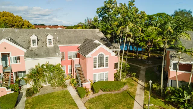 aerial view of a house with a yard