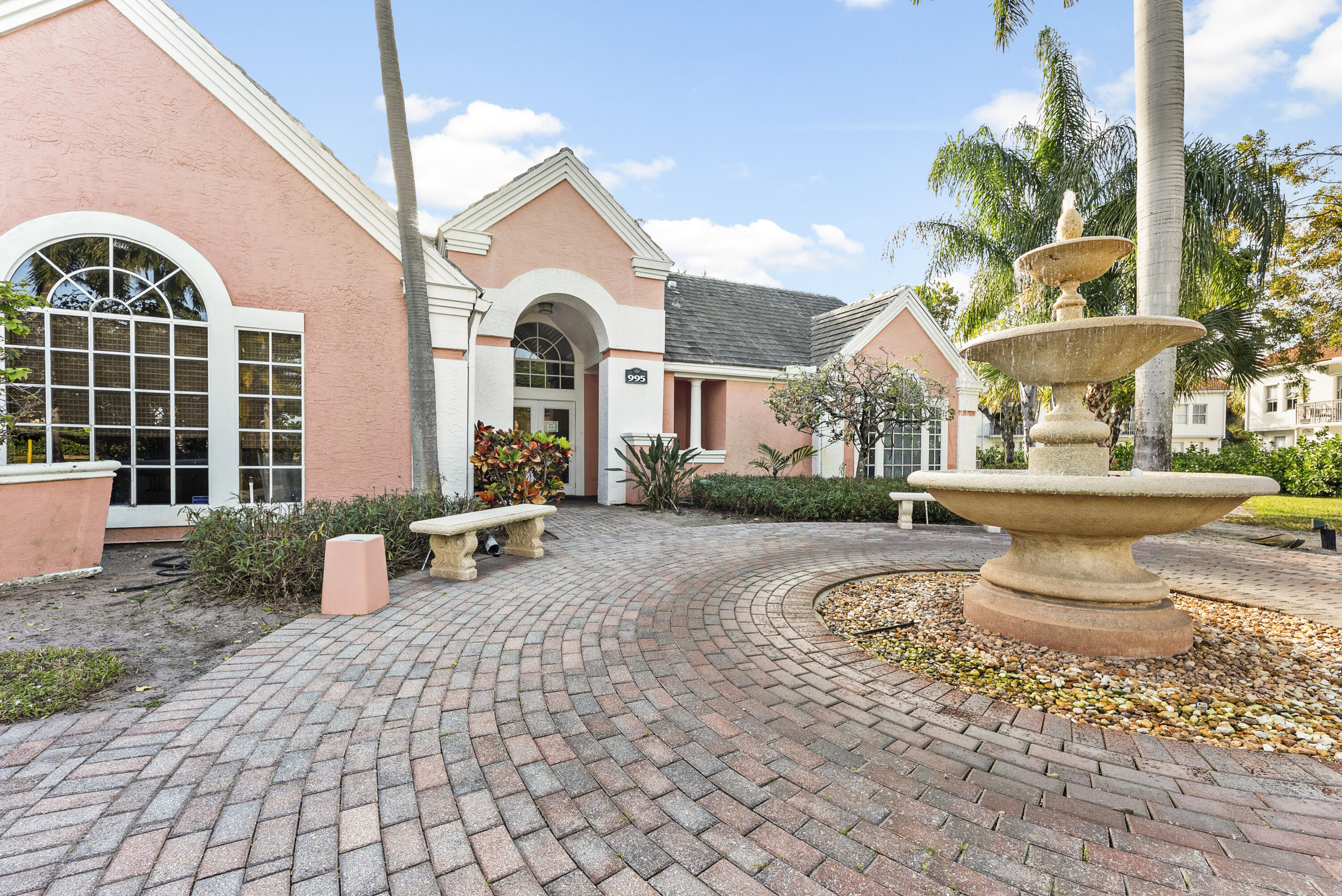 1365 Crystal Way, Unit H Delray Beach, FL 33444 - Photo 26 of 34 a front view of a house with garden